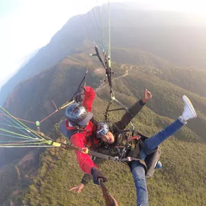 man excited while taking photo with GoPro at Paragliding in Kathmandu