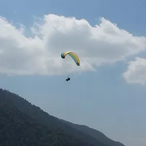 Paragliding flying above Mountains in Kathmandu Paragliding